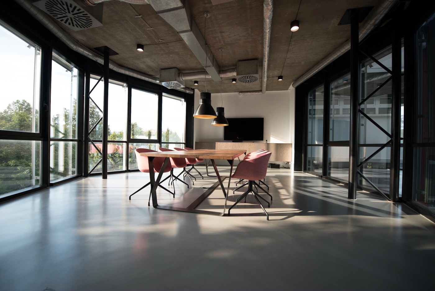 A bright, modern open-plan office meeting area